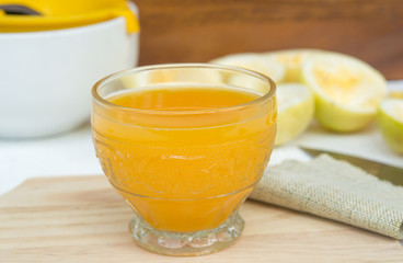 passion fruit and Juice in glass on wood table