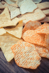 Vintage photo, Heap of salted crisps and cookies, concept of unhealthy food