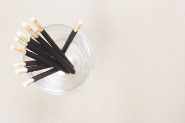 Chocolate biscuits sticks in glass