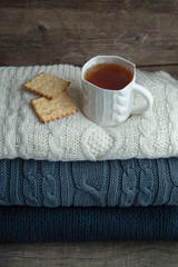 tea Cup on a stack sweater