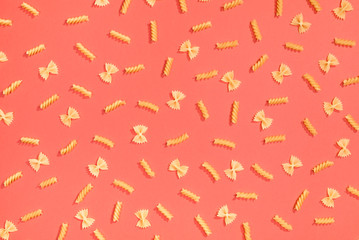 Farfalle and fusilli pasta flat lay pattern