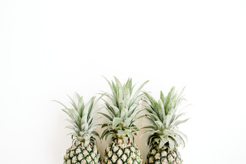 Three pineapples. Flat lay, top view