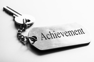 Achievement word with key.Business motivation