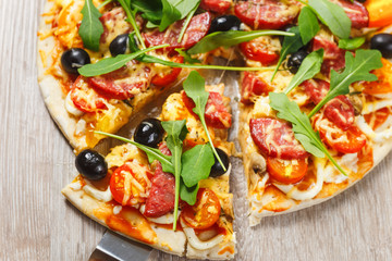 Taking slice of pizza