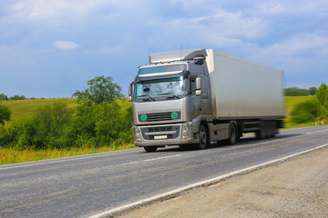 Fototapeta na wymiar truck moves on country highway