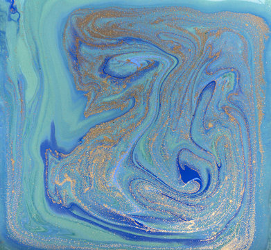 Blue and golden marbled liquid texture