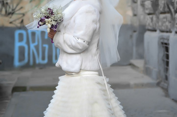 Beautiful bride and groom with bouquet before wedding ceremony