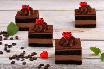Delicious cream cake with red hearts