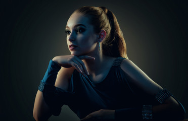 Low key portrait of a beautiful girl. Studio shot