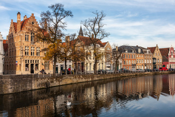 Fototapeta na wymiar Bruges Belgium, October 28, 2009 : antique style building and canal in city of bruges.