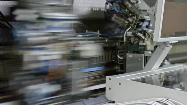 Closeup of working soldering machine for printed circuit board 
