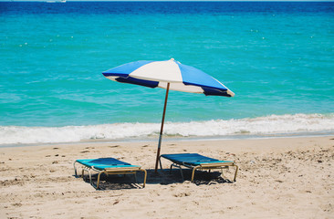 Two beach chairs on tropical vacation
