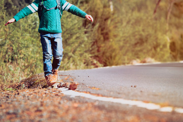 little boy travel along the road, focus on feet