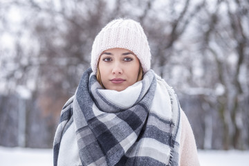 Portrait of a beautiful blonde woman in in the snow