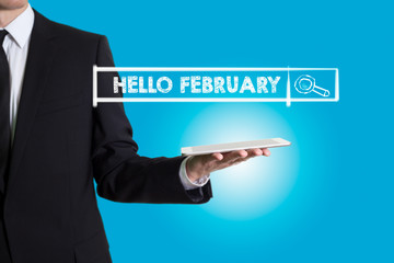 Hello February, young man holding a tablet computer