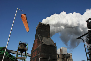 Steam from a coke ovenwater quenching tower and wind direction indicator.