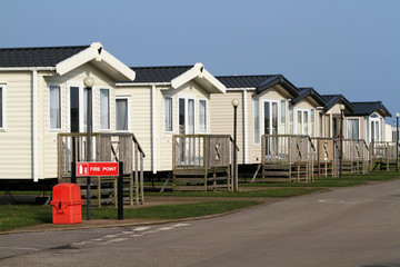 Row of large static caravans on holiday home site in Yorkshire, UK, on the north sea coast.