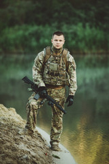 Fototapeta premium Special forces soldiers with weapon take part in military maneuv