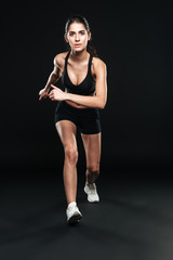 Full-length photo of running woman