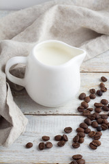 coffee beans and milk jug