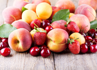 mixed of fresh fruits on wooden table