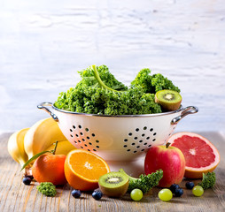 Fresh kale cabbage, fruits and berries, ingredients for smoothie