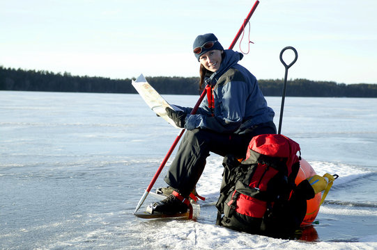 Women skater on frozen lake