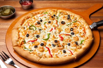 shrimp pizza on plate