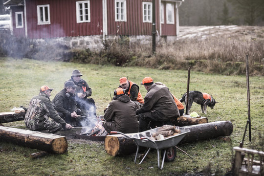 Hunters At Campfire