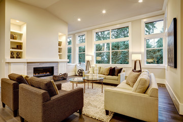 Chic light living room design with dark floors.