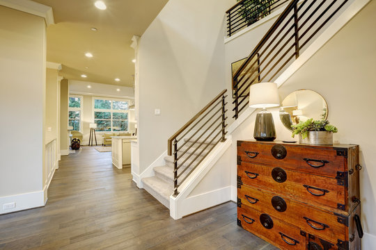 Light Modern Hallway Design Boasts Steamer Trunk Dresser