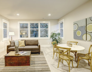 Family room interior with gray sofa and trunk coffee table