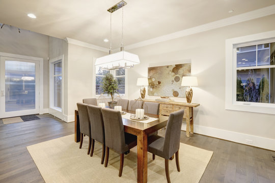 Lovely dining room with rectangular table and grey chairs