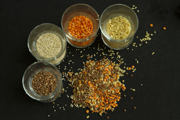 Four different groats: buckwheat, lentil, quinoa, bulgur, in tra
