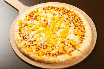cheese pizza on a board