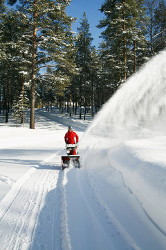 Person pulling snowplow