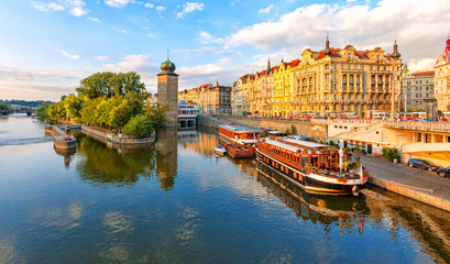 Fototapeta premium Masarykovo embankment. Vltava river. Prague, Czech Republic. Landmarks of the Prague. Floating restaurant on the Vltava River.