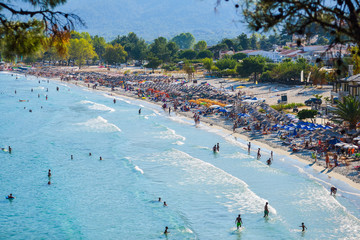 Tourists on the Golden Beach in Thassos Island, Greece
