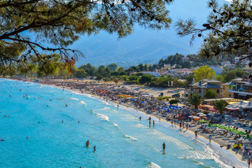 Tourists on the Golden Beach in Thassos Island, Greece