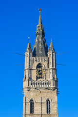 Fototapeta na wymiar The Belfry tower with clock in Ghent, Belgium
