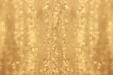 Abstract gold glitter background. Twinkled texture. Bokeh ligh
