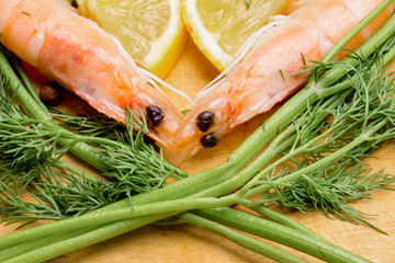 the heart symbol of shrimp, parsley, lemon and spices for cooking a romantic dinner