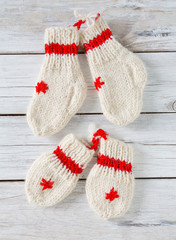 knitted baby socks and mittens