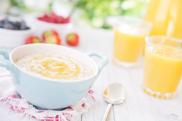 Oatmeal porridge on a rustic table