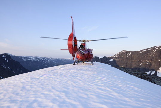 Helicopter on snowy peak