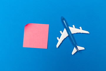 Fototapeta premium model of passenger plane on blue background