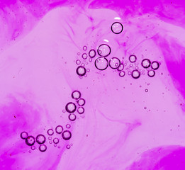 purple bubbles in water close-up abstract background