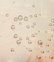 Water bubbles in a glass container close up