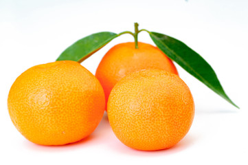 orange fruits with leaves isolated on white background