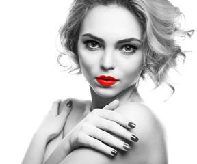 Young woman with color accent in makeup on white background